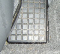2009 Toyota Prius - floor mat tucked securely under the left footrest 